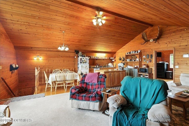 64320 Trail Rd, Anchor Point, AK 99556 - living area with wooden walls, vaulted ceiling, a chandelier, wooden ceiling, and ceiling fan