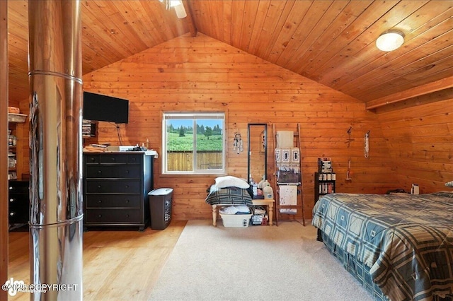 64320 Trail Rd, Anchor Point, AK 99556 - bedroom with lofted ceiling, wooden walls, wooden ceiling, and carpet flooring