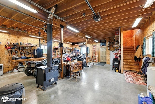 64320 Trail Rd, Anchor Point, AK 99556 - garage with a workshop area and a garage door opener