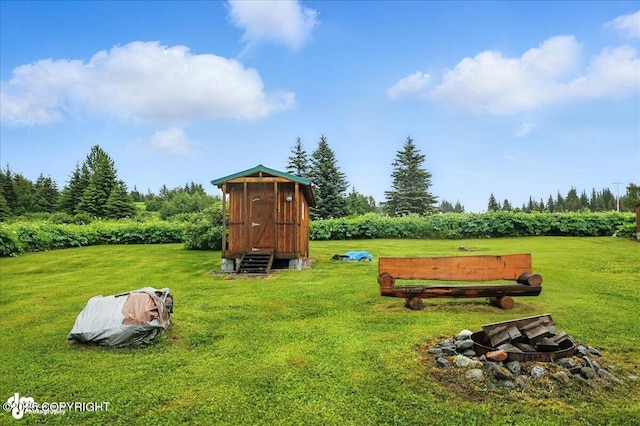 64320 Trail Rd, Anchor Point, AK 99556 - view of outbuilding with a fire pit