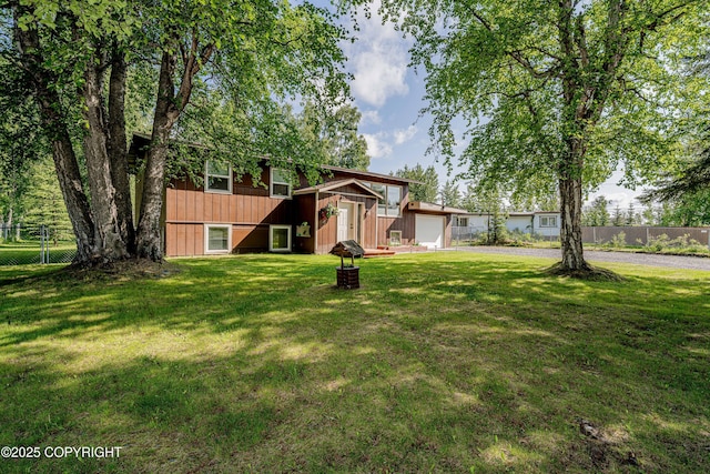 312 W Riverview Ave, Soldotna, AK 99669 - view of front of property with a garage, an outdoor structure, and driveway