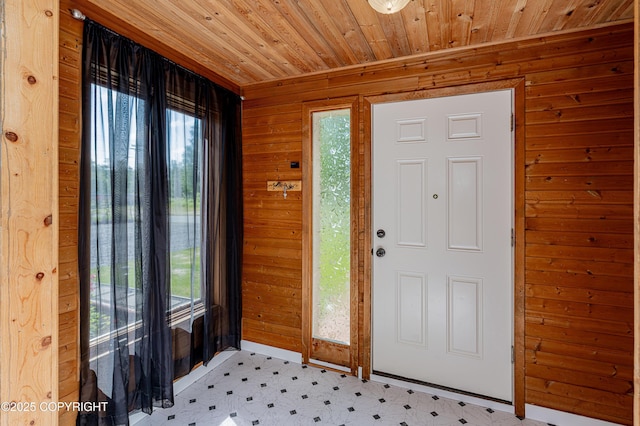 312 W Riverview Ave, Soldotna, AK 99669 - entryway with plenty of natural light, light flooring, wooden walls, and wooden ceiling