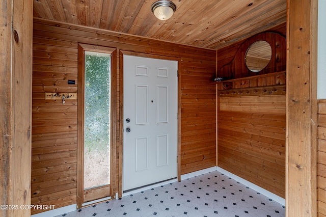 312 W Riverview Ave, Soldotna, AK 99669 - entryway with tile patterned floors, wood walls, and wooden ceiling