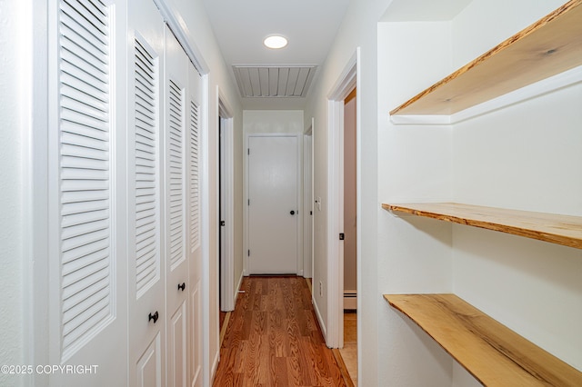 312 W Riverview Ave, Soldotna, AK 99669 - hallway featuring light wood-style floors, recessed lighting, and a baseboard heating unit
