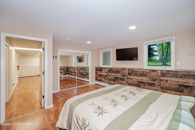 312 W Riverview Ave, Soldotna, AK 99669 - bedroom with light wood-style flooring, baseboard heating, recessed lighting, and a closet