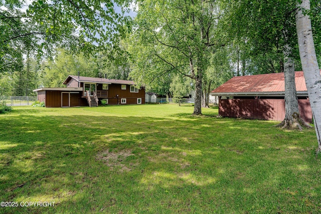 312 W Riverview Ave, Soldotna, AK 99669 - view of yard featuring stairway, a deck, and an outbuilding