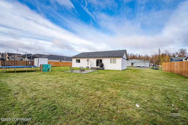 1302 E Esty Dr, Palmer, AK 99645 - rear view of property with a trampoline and a patio
