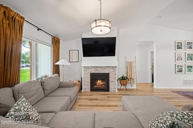 1302 E Esty Dr, Palmer, AK 99645 - living room with lofted ceiling, wood finished floors, and a fireplace