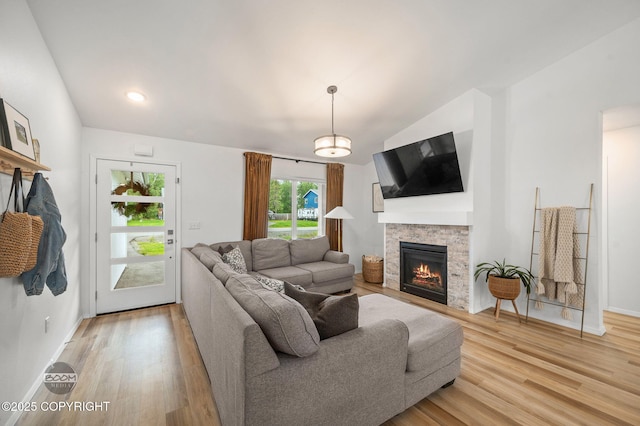 1302 E Esty Dr, Palmer, AK 99645 - living room with lofted ceiling, light wood-type flooring, and a fireplace