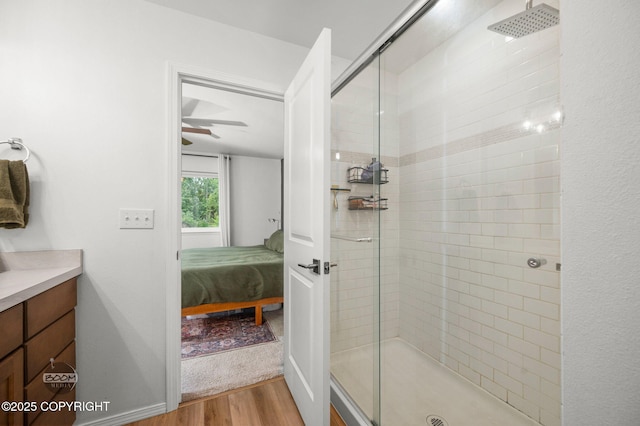 1302 E Esty Dr, Palmer, AK 99645 - ensuite bathroom with wood finished floors, a shower stall, and vanity