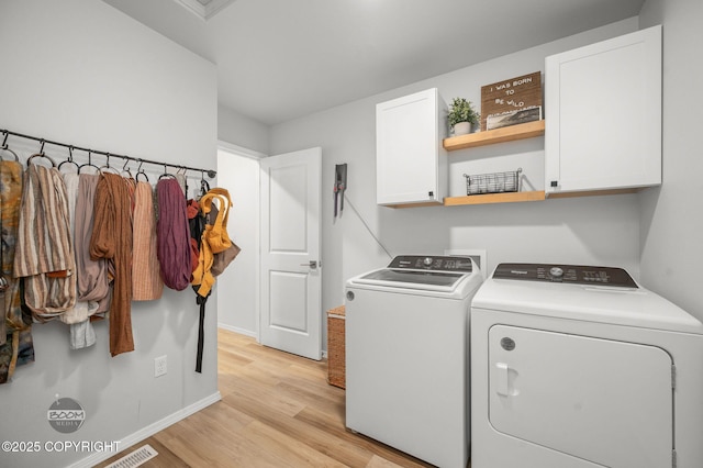 1302 E Esty Dr, Palmer, AK 99645 - washroom with cabinet space, washing machine and clothes dryer, and light wood finished floors