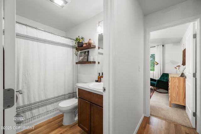 1302 E Esty Dr, Palmer, AK 99645 - full bathroom with wood finished floors, vanity, and a shower with curtain