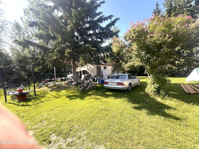 4002 Barbara Dr, Anchorage, AK 99517 - view of grassy yard featuring view of wooded area