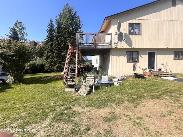 4002 Barbara Dr, Anchorage, AK 99517 - back of house featuring a yard, stairs, and a wooden deck