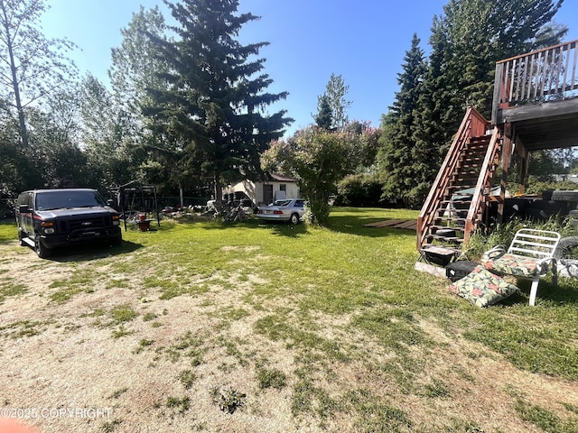 4002 Barbara Dr, Anchorage, AK 99517 - view of green lawn with stairs and view of scattered trees