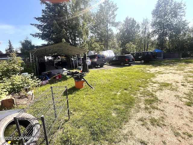 4002 Barbara Dr, Anchorage, AK 99517 - view of green lawn with a carport