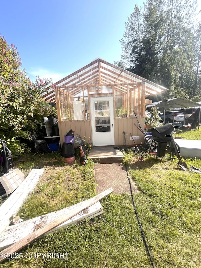 4002 Barbara Dr, Anchorage, AK 99517 - view of front of house with a greenhouse and an outbuilding