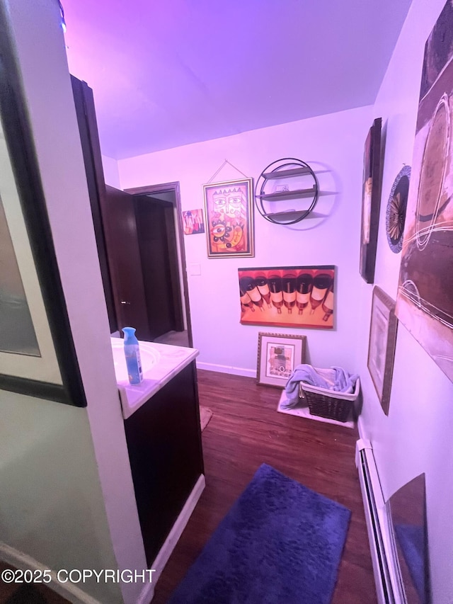 4002 Barbara Dr, Anchorage, AK 99517 - hall with dark wood-style flooring and a baseboard heating unit
