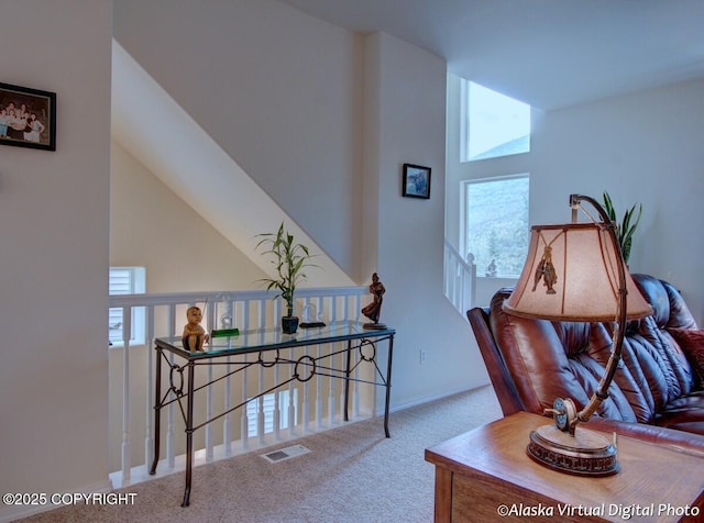 20103 Riverside Dr # 1B, Eagle River, AK 99577 - hall featuring carpet floors, lofted ceiling, and an upstairs landing