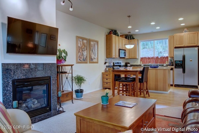 20103 Riverside Dr # 1B, Eagle River, AK 99577 - living room with light wood-style flooring, a fireplace, and recessed lighting