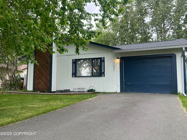 3621 Cloudberry Cir, Anchorage, AK 99507 - view of front facade with an attached garage, driveway, a shingled roof, and a front yard
