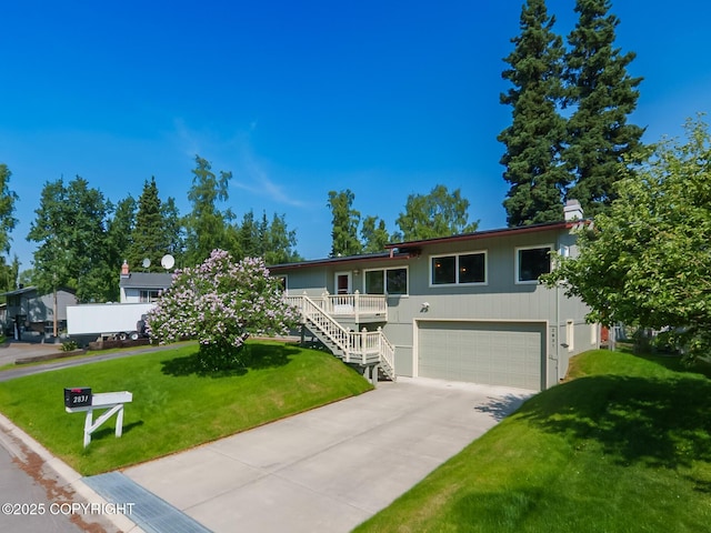 2831 Bennett Ave, Anchorage, AK 99517 - view of front facade with an attached garage, driveway, a front yard, and stairway