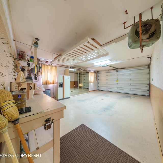 2831 Bennett Ave, Anchorage, AK 99517 - garage with white refrigerator with ice dispenser and a garage door opener