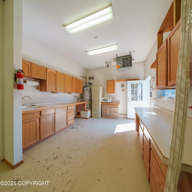 2831 Bennett Ave, Anchorage, AK 99517 - kitchen featuring water heater, a heating unit, white microwave, light countertops, and open shelves