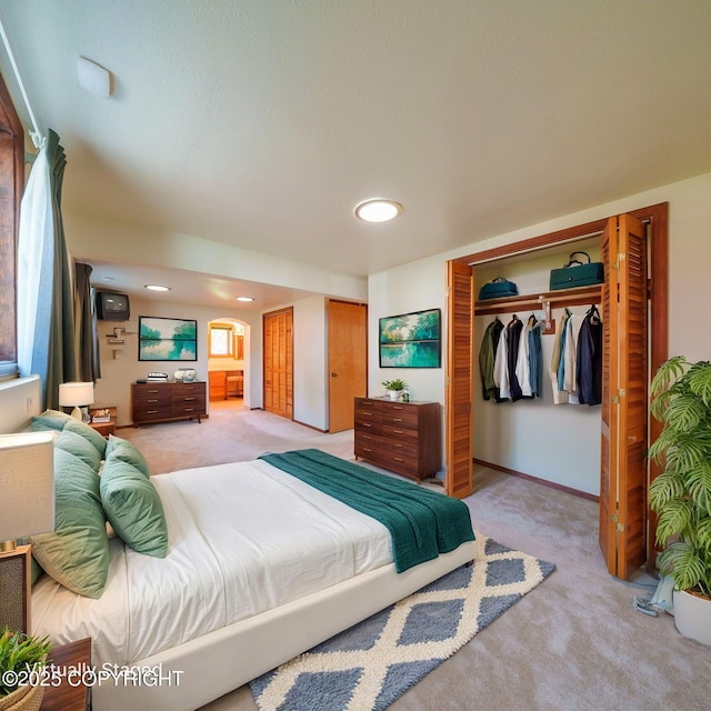 2831 Bennett Ave, Anchorage, AK 99517 - bedroom featuring light colored carpet, recessed lighting, and two closets