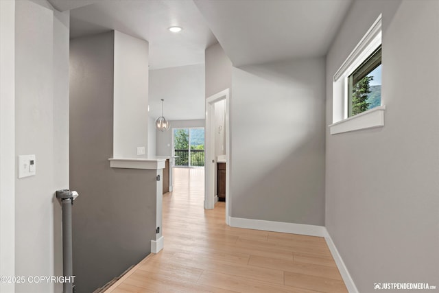 20218 Eagles Nest Ct, Eagle River, AK 99577 - hallway with light wood-type flooring, an upstairs landing, and recessed lighting