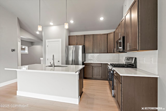 20218 Eagles Nest Ct, Eagle River, AK 99577 - kitchen with stainless steel appliances, decorative backsplash, light wood finished floors, light countertops, and recessed lighting