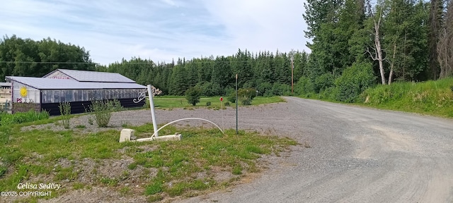 48105 Halverson Ave, Soldotna, AK 99669 - view of road featuring a wooded view
