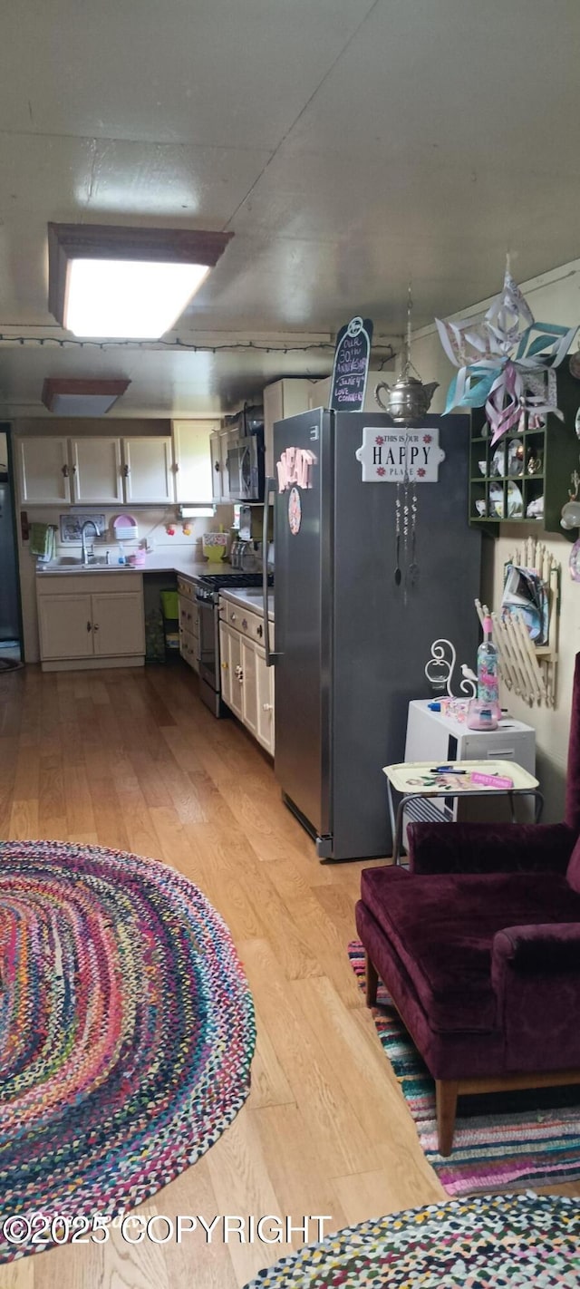 48105 Halverson Ave, Soldotna, AK 99669 - kitchen featuring stainless steel appliances and light wood-type flooring