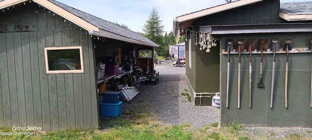 48105 Halverson Ave, Soldotna, AK 99669 - view of home's exterior featuring a shingled roof and an outdoor structure