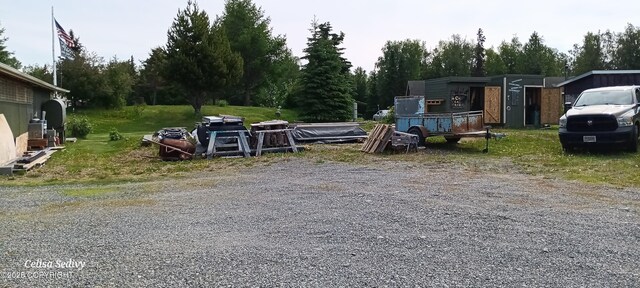 48105 Halverson Ave, Soldotna, AK 99669 - view of yard with view of wooded area