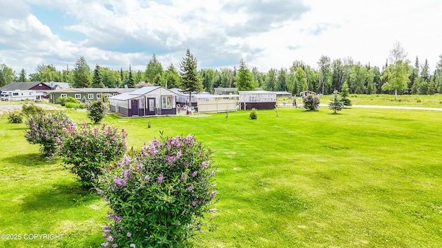 48105 Halverson Ave, Soldotna, AK 99669 - view of green lawn featuring view of wooded area