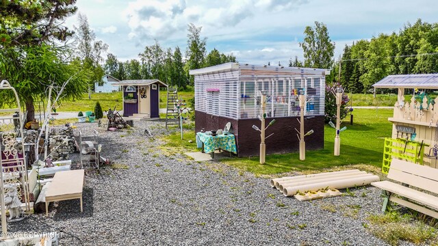 48105 Halverson Ave, Soldotna, AK 99669 - back of property featuring a lawn