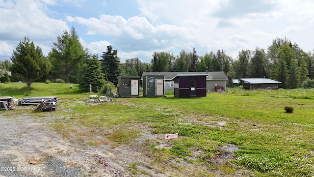 48105 Halverson Ave, Soldotna, AK 99669 - view of grassy yard featuring a storage shed