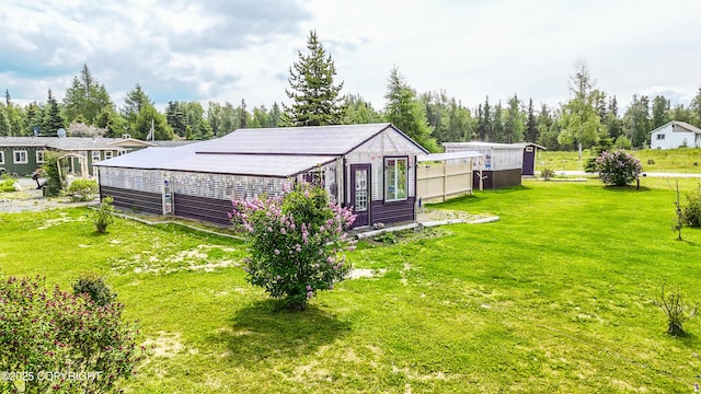 48105 Halverson Ave, Soldotna, AK 99669 - view of grassy yard with an outdoor structure and view of wooded area