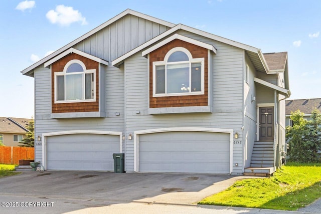 6218 Ophir Dr, Anchorage, AK 99504 - view of front of house featuring an attached garage and driveway