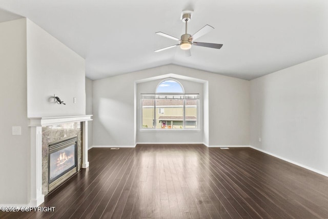6218 Ophir Dr, Anchorage, AK 99504 - unfurnished living room featuring a ceiling fan, lofted ceiling, a premium fireplace, and dark wood-type flooring