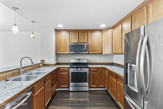 6218 Ophir Dr, Anchorage, AK 99504 - kitchen with stainless steel appliances, dark wood-type flooring, hanging light fixtures, recessed lighting, and brown cabinets