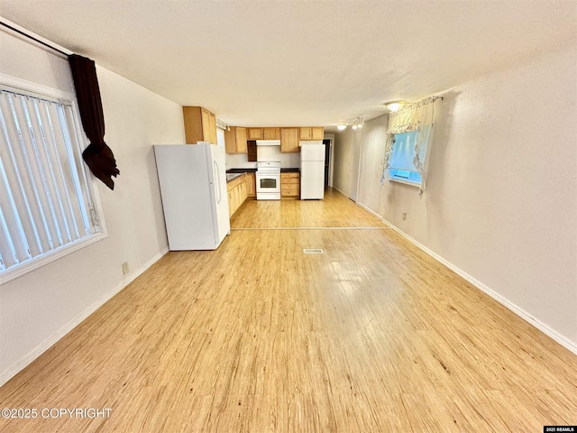 6590 Glacier Hwy, Juneau, AK 99801 - unfurnished living room featuring light wood-type flooring and baseboards