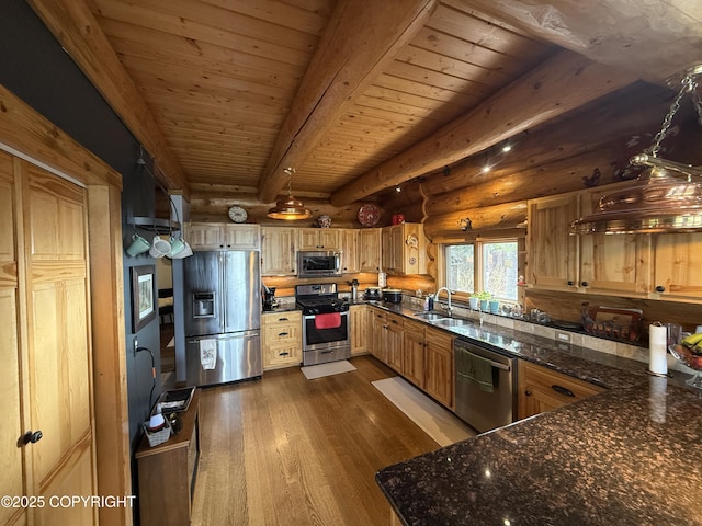 35605 Kalifornsky Beach Rd, Kenai, AK 99669 - kitchen featuring appliances with stainless steel finishes, rustic walls, dark wood-type flooring, a wood ceiling with exposed beams, and dark stone counters
