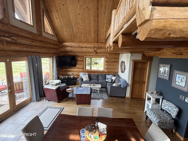 35605 Kalifornsky Beach Rd, Kenai, AK 99669 - living area featuring rustic walls, light wood-style floors, wooden ceiling, high vaulted ceiling, and french doors
