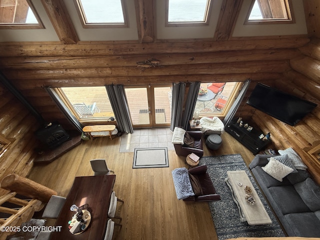 35605 Kalifornsky Beach Rd, Kenai, AK 99669 - living area with log walls, wood finished floors, and a high ceiling