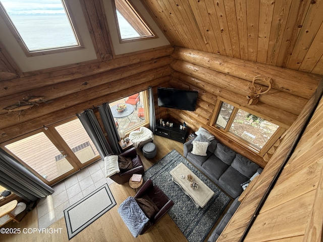 35605 Kalifornsky Beach Rd, Kenai, AK 99669 - living area with rustic walls, plenty of natural light, wood finished floors, and wood ceiling