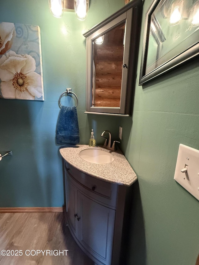 35605 Kalifornsky Beach Rd, Kenai, AK 99669 - bathroom featuring wood finished floors and vanity