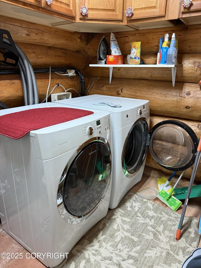 35605 Kalifornsky Beach Rd, Kenai, AK 99669 - laundry room with cabinet space, washing machine and dryer, and log walls