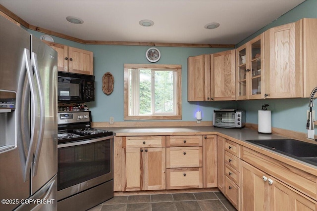 1685 Taroka Dr, Fairbanks, AK 99709 - kitchen featuring appliances with stainless steel finishes, light brown cabinetry, and glass insert cabinets